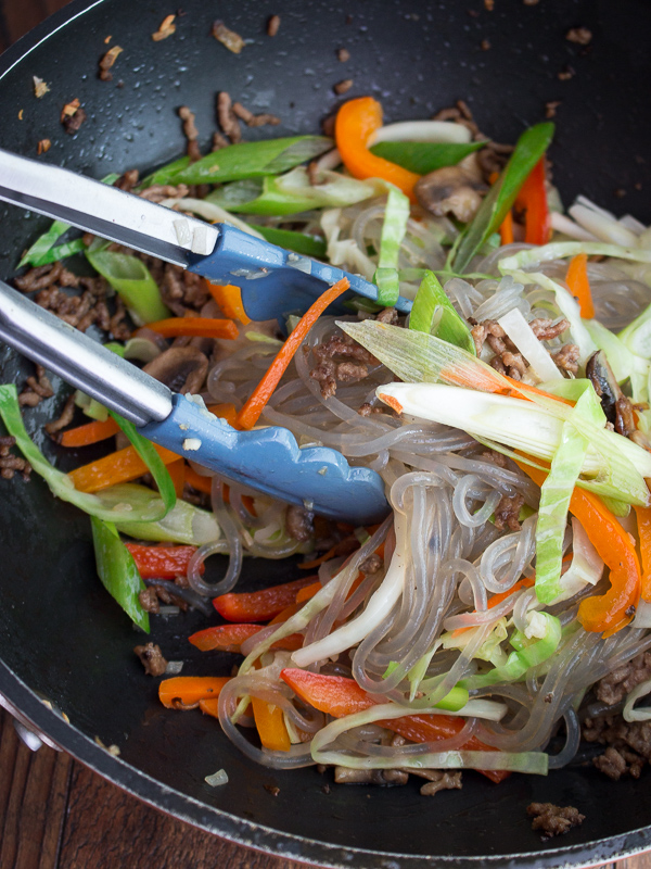 Cooking Camote Bihon in a wok.
