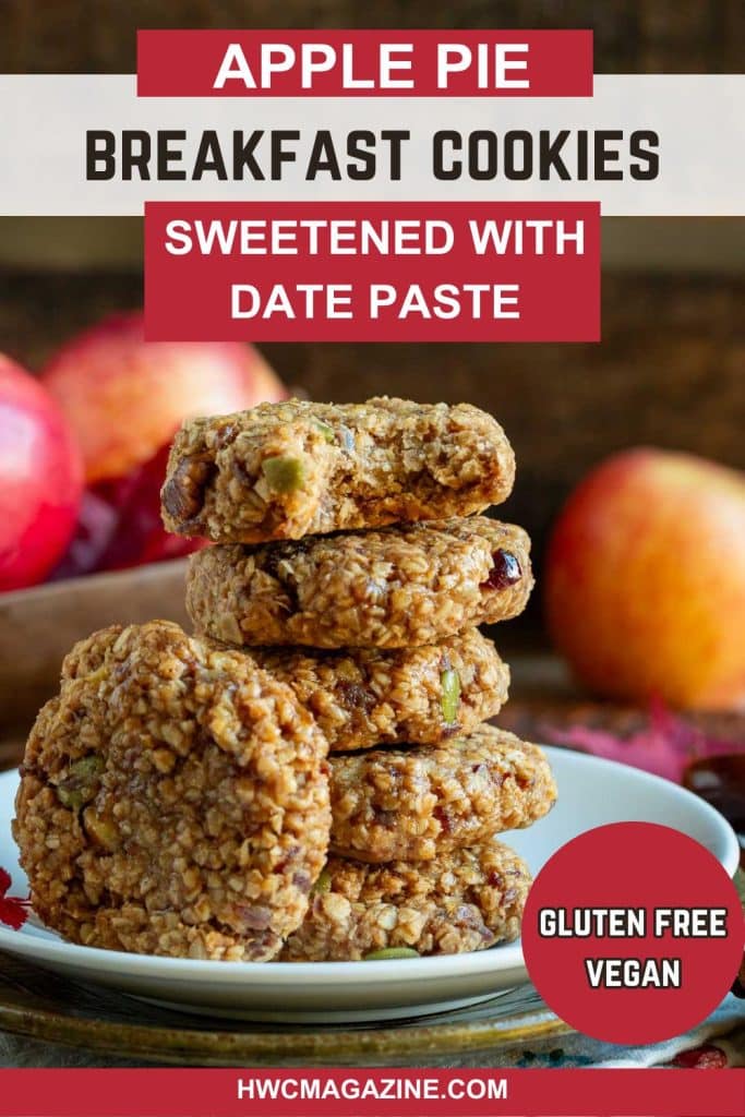 Stack of apple oatmeal date cookies on a white plate with a bite out of one.