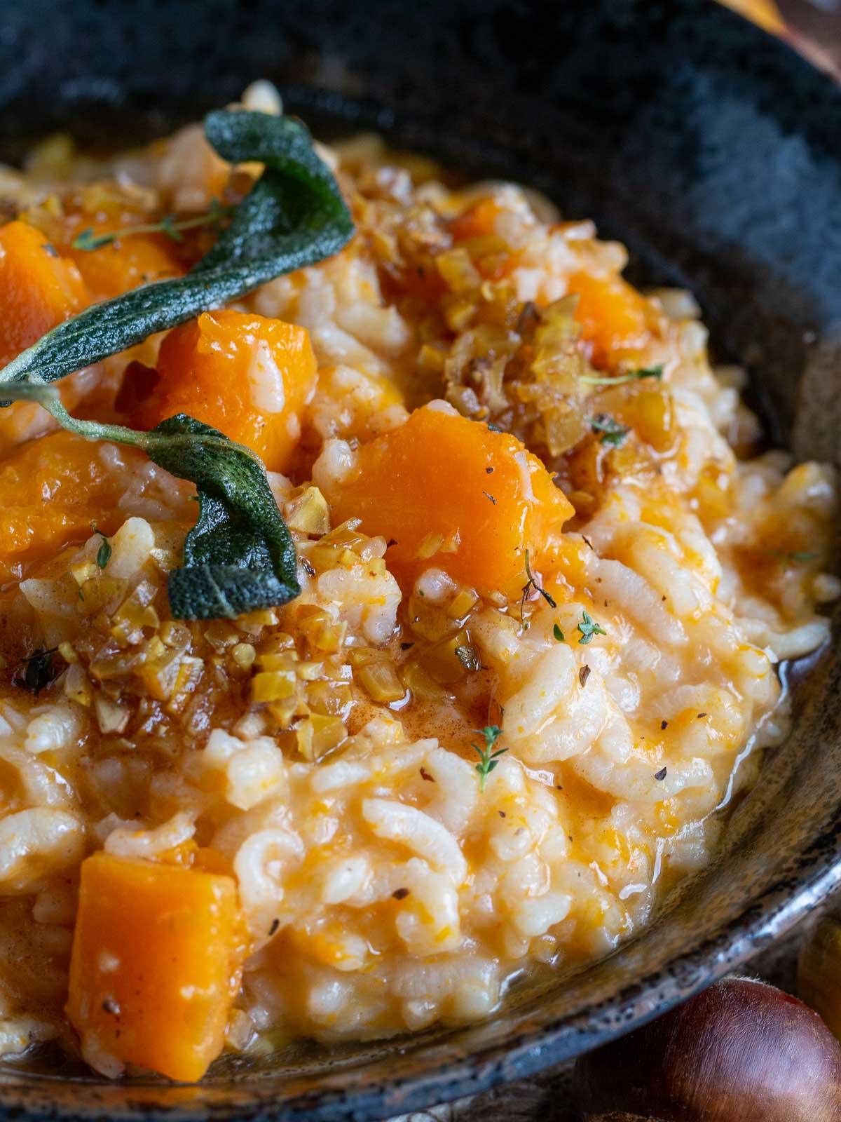 Instant Pot Cooked pumpkin risotto drizzled with a brown butter sage chestnut sauce.