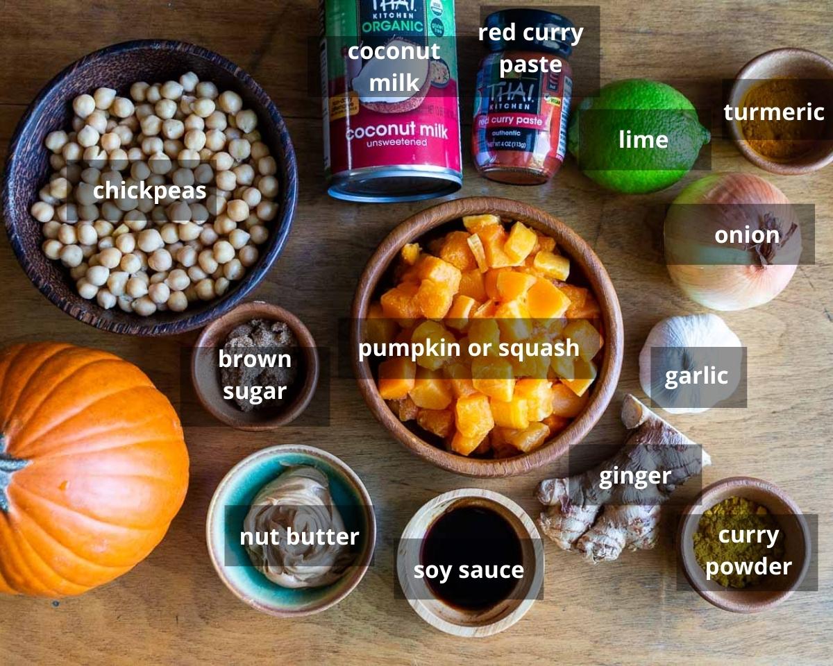 Thai Pumpkin Curry Ingredients laid out on a wooden table.