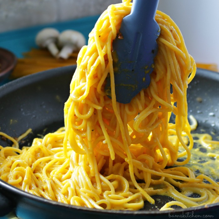 Vegan Truffle Pasta getting tossed in a pan.