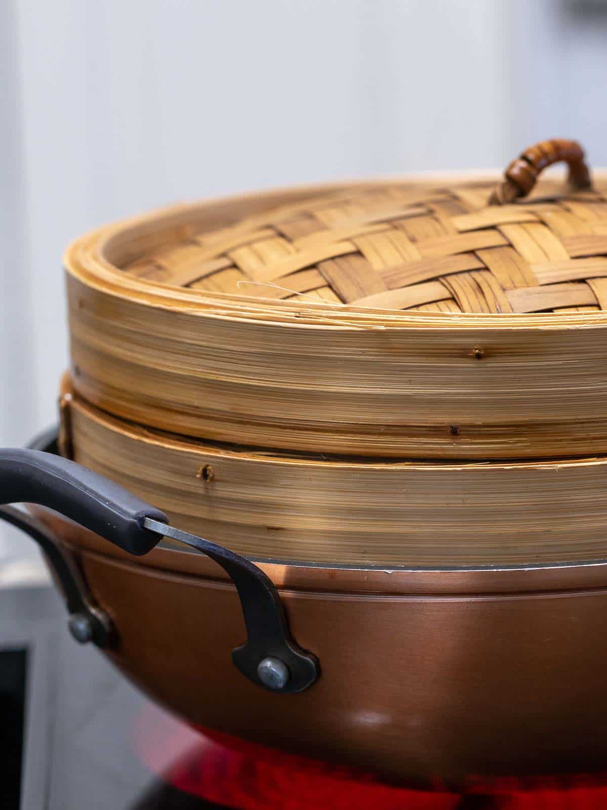 Proper steamer sitting in a wok.