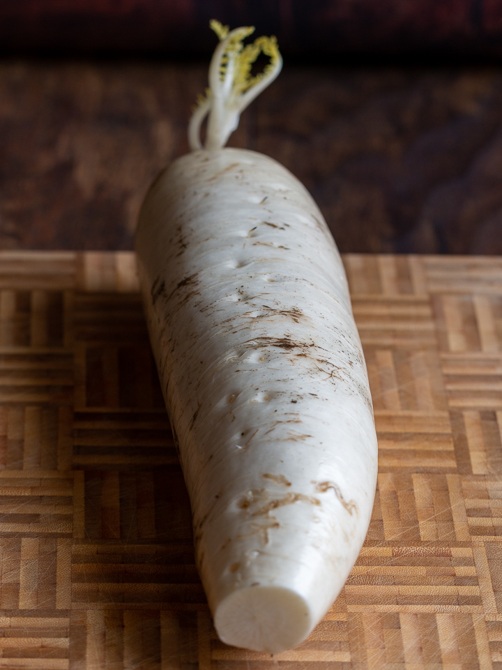 Daikon radish on a cutting board.