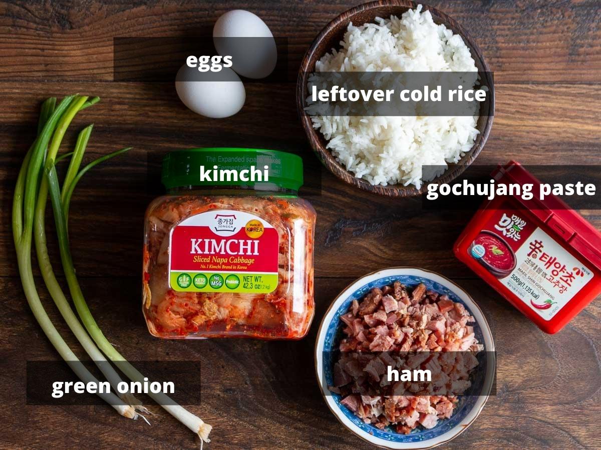Ingredients to make Korean Fried rice on a wooden board.