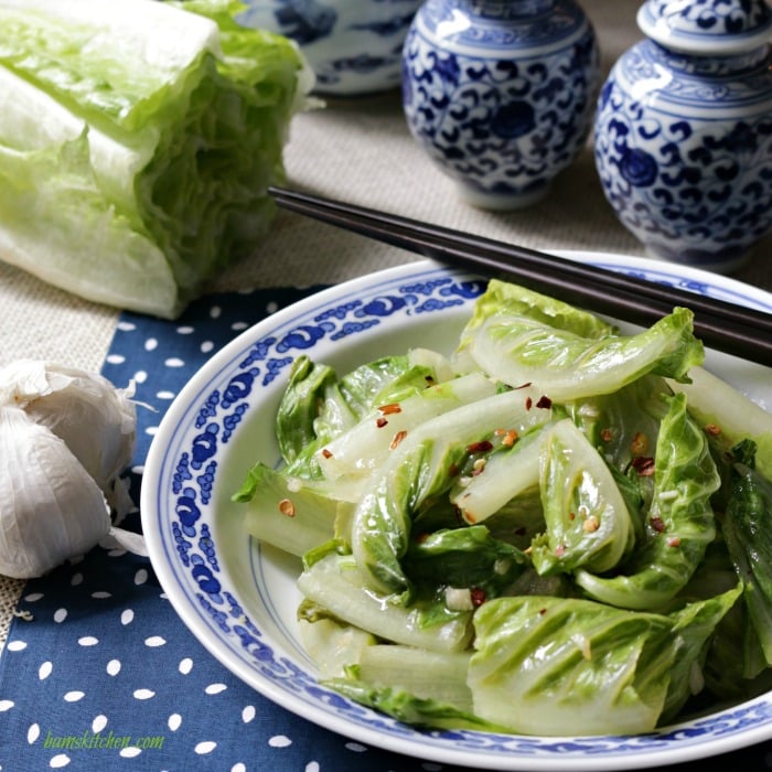 Stir Fried Romaine Lettuce in a beautiful blue designed Foshan, China plates and cups. 