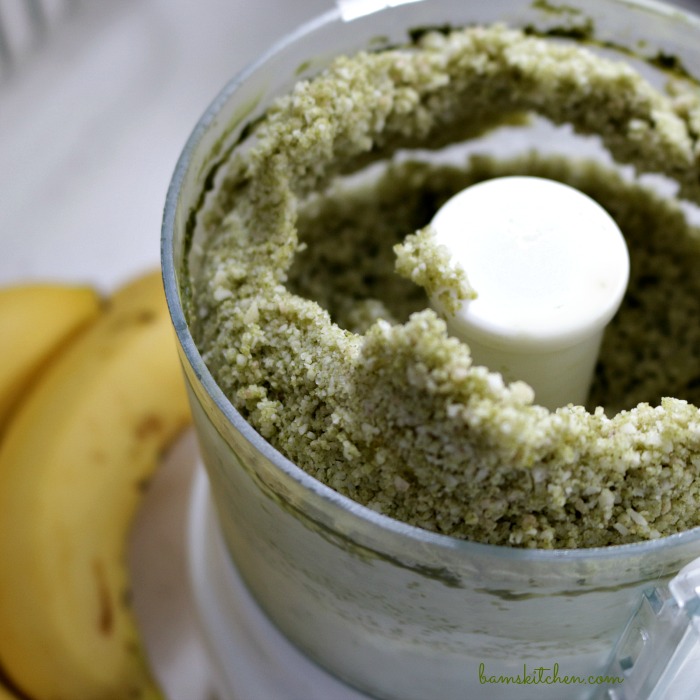 Matcha and bananas that have started in the food processor looking like grains of sand.