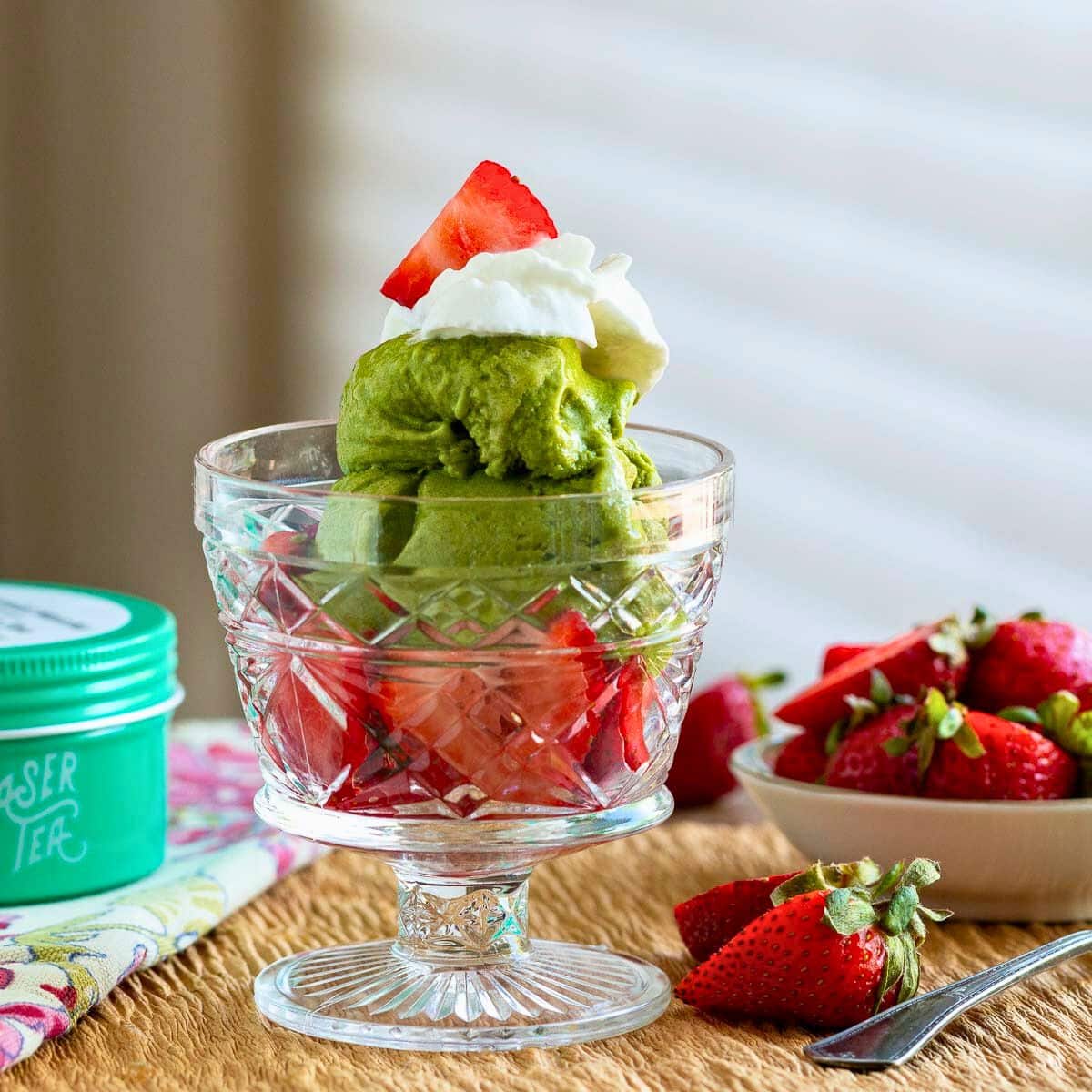 Matcha strawberry nice cream cups topped with homemade coconut whipped topping and berries.