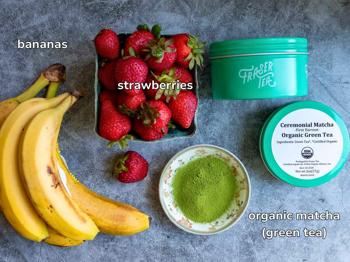 Ingredients to make a vegan matcha ice cream laid on a grey table. 