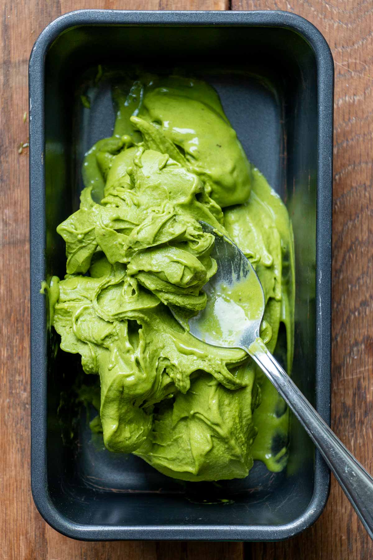 Soft serve matcha ice cream in a loaf tin. 