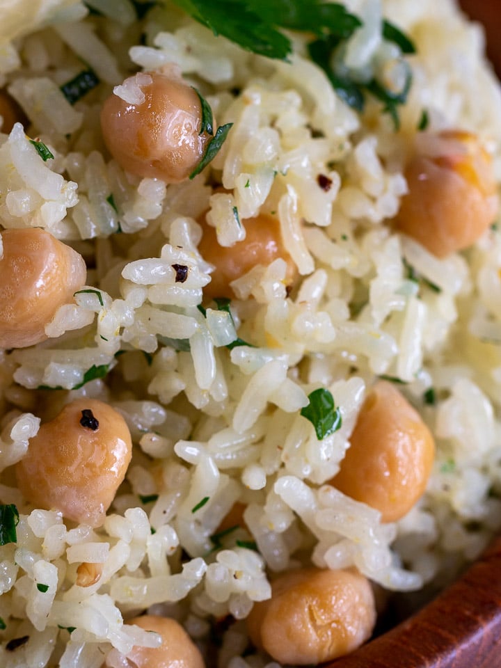 Close up shot of rice with garbanzo beans showing each grain of rice perfectly cooked. 