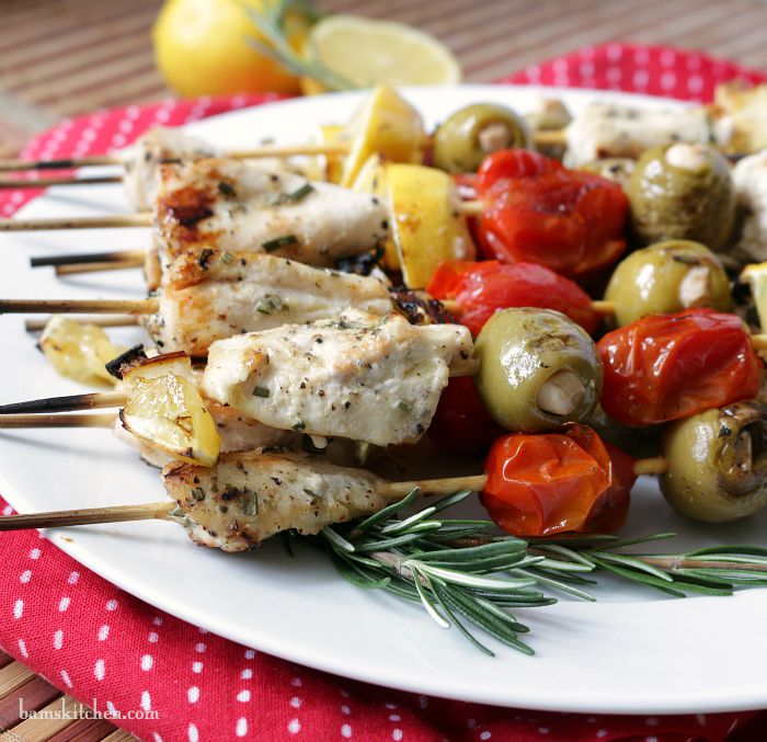 Close up shot of the kabobs showing the garlic stuffed in the grilled olives.