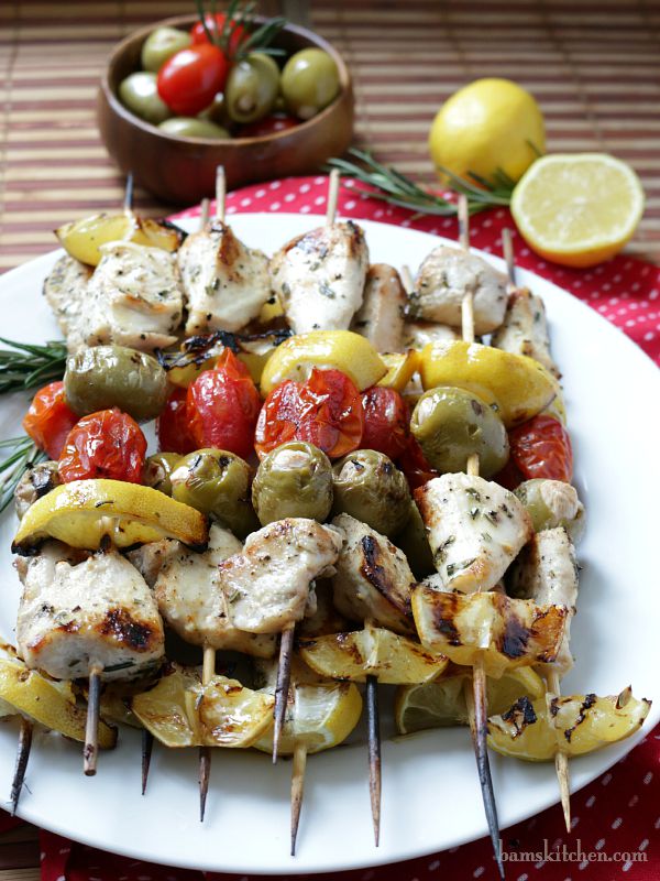 Showing the charred lemons on the kababs