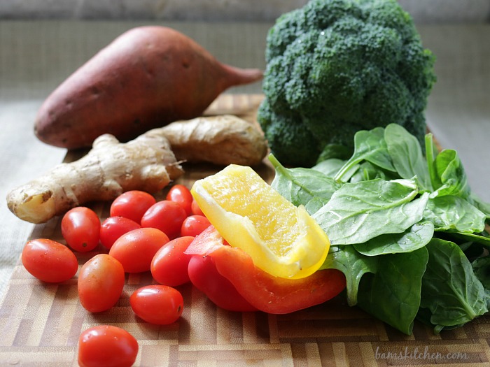 Vegetables on cutting board ready to be chopped.