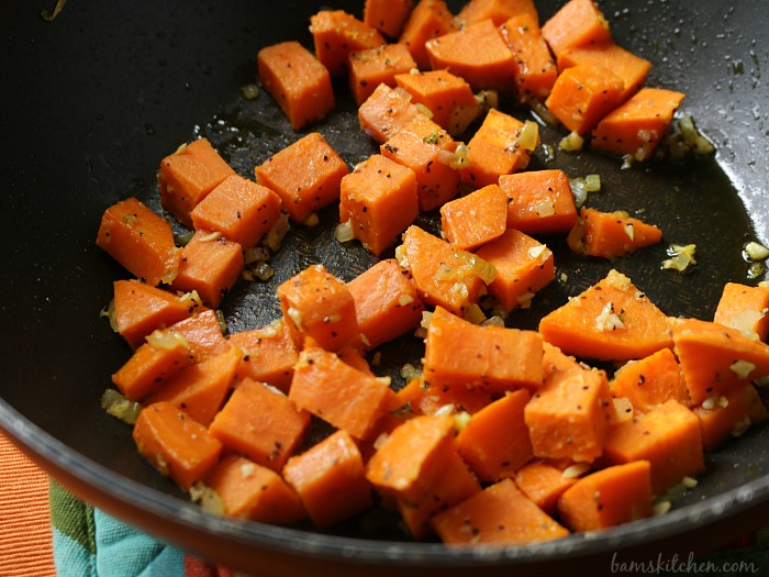 Yams frying in a pan.