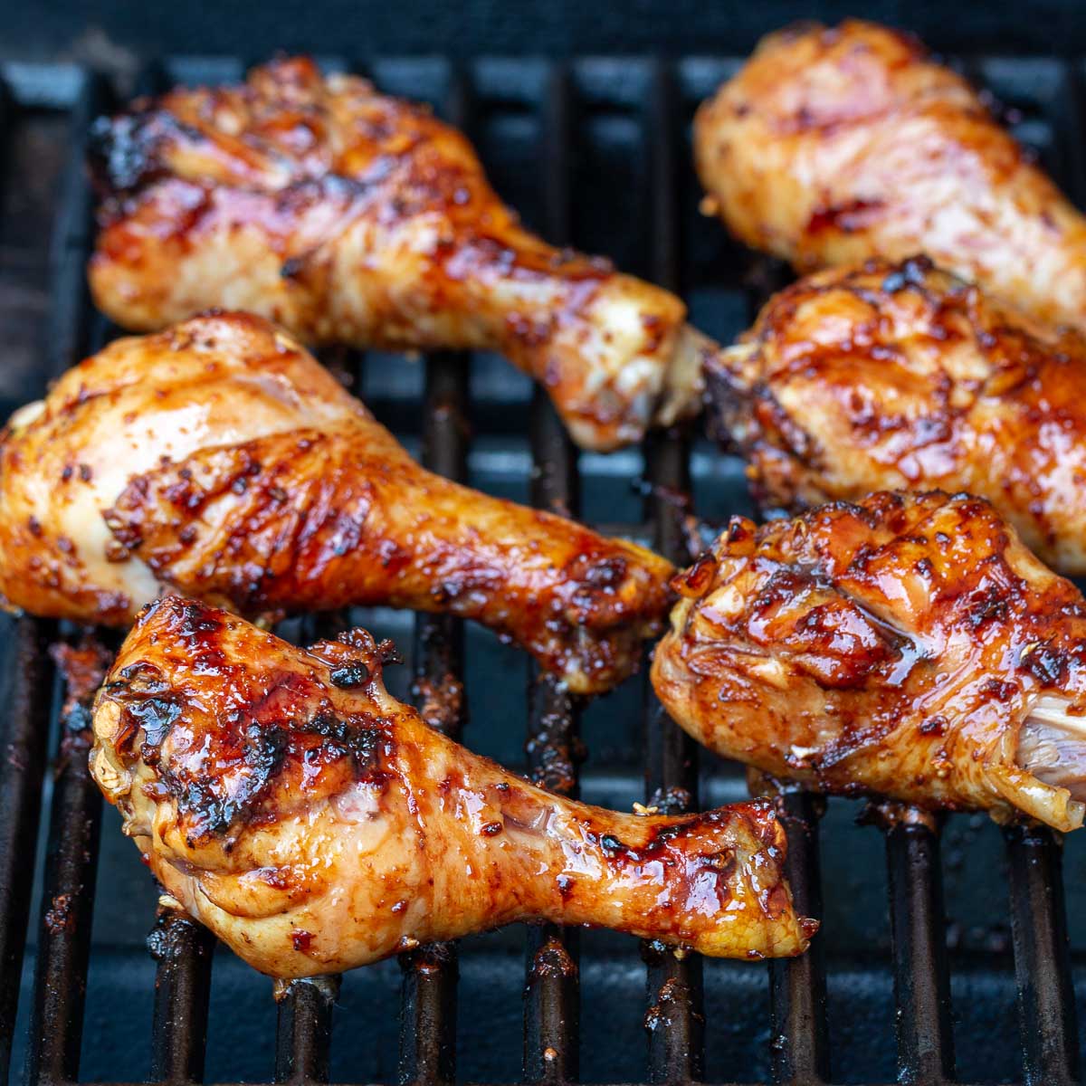 Chicken drumsticks on the gas grill.