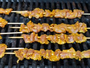 Turmeric Pork Skewers on the grill.