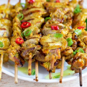 Grilled Thai Pork Tenderloins on a white plate.