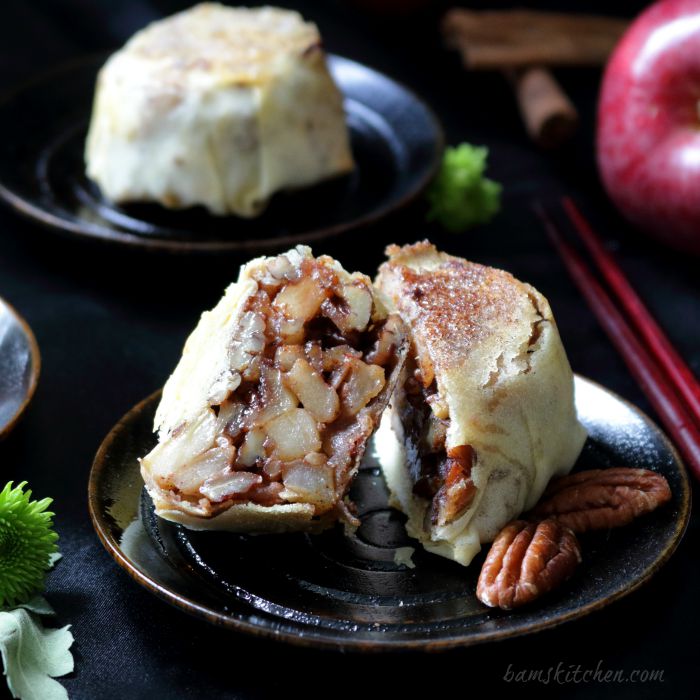 Mooncake cut in half to show the apple and pecan filling.