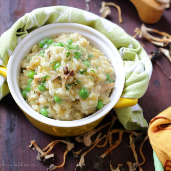 Top down photo showing the creamy risotto with mushrooms and peas.