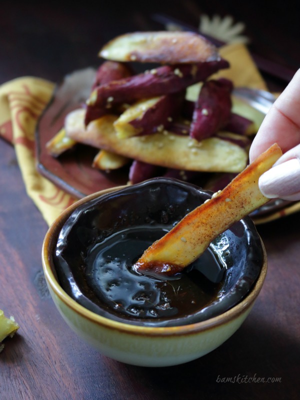 Fry getting dunked in the dipping sauce.