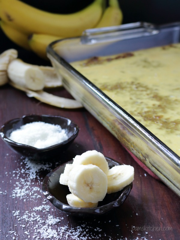 Showing all the garnishes like bananas and coconut with a 9x13 pan ready to go in the oven.