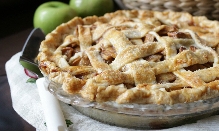 Grandma's old fashion apple pie ready to be cut into.