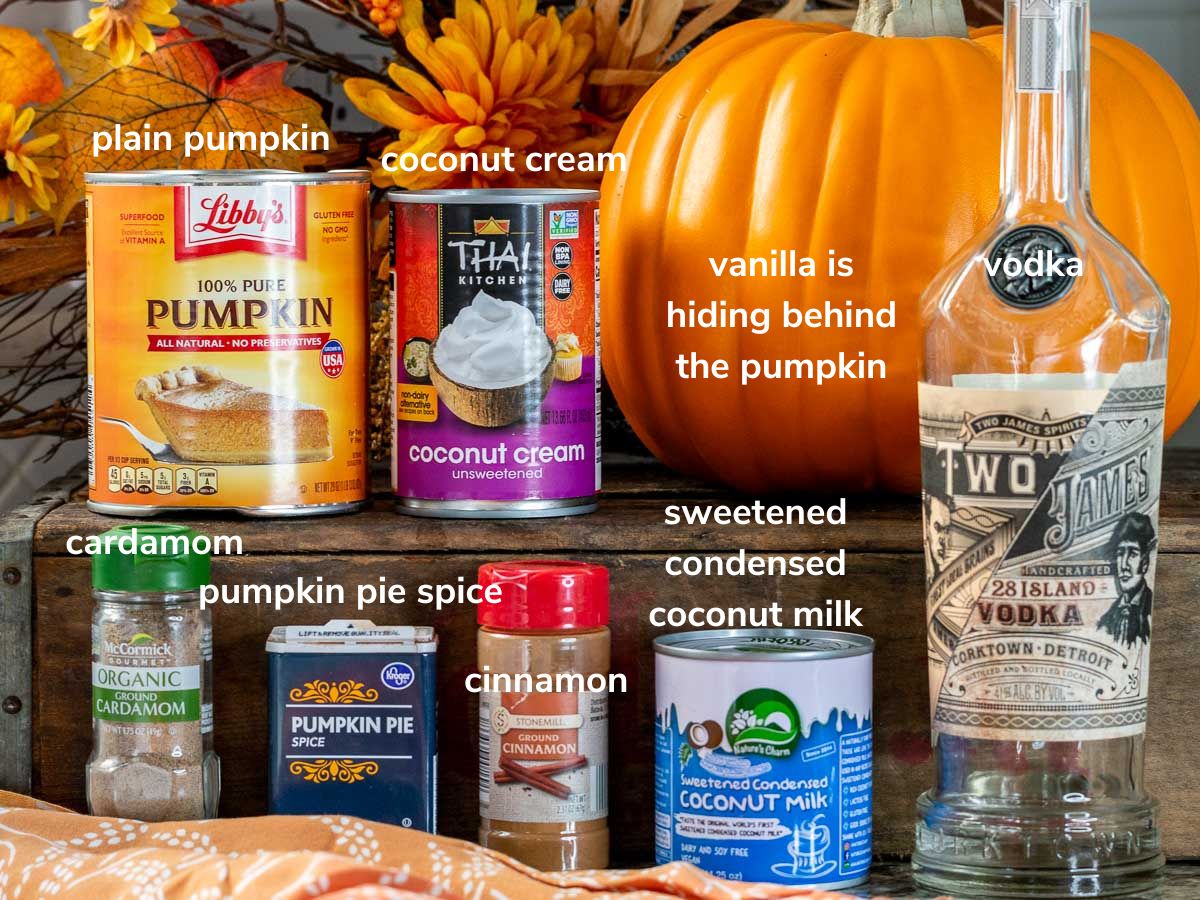 Ingredients for the pumpkin ice cream laid out on a wooden shelf.