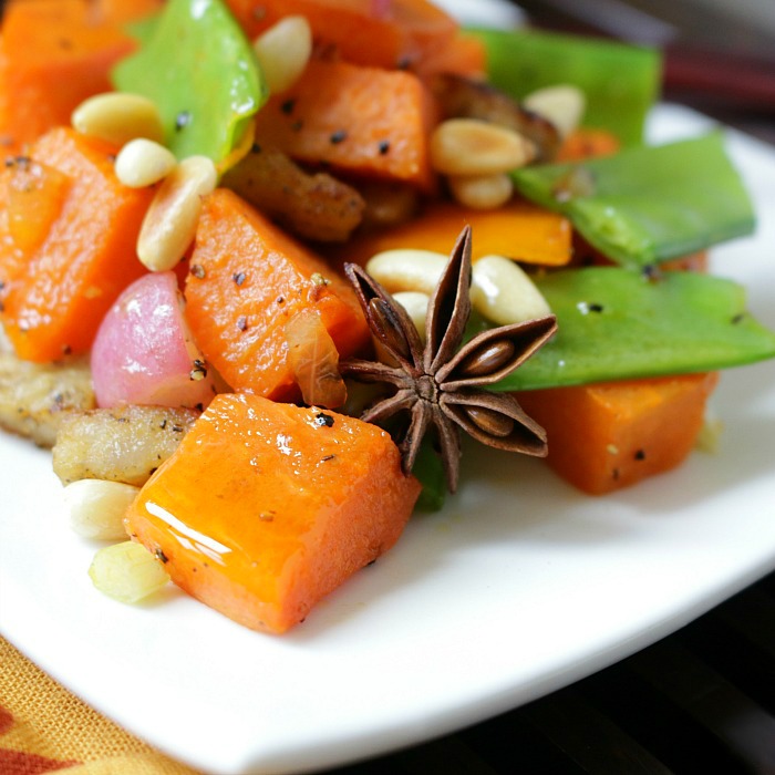 Close up to show the star anise and all the vibrant vegetables.