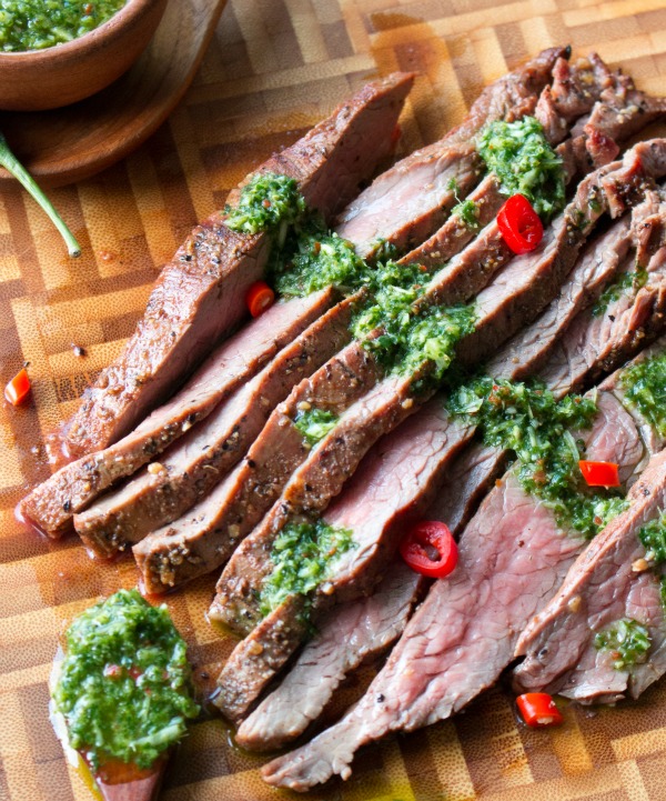 Grilled Flanks Steaks on a wooden cutting board. 