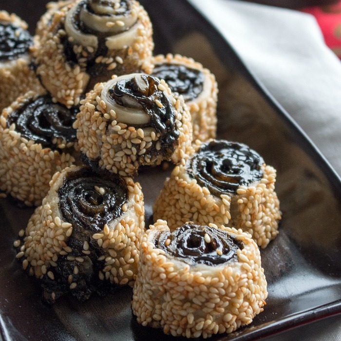 Sesame Pie swirl Cookies on a brown plate.