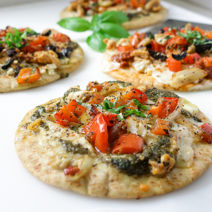 Pizza with basil pesto and chicken and veggies.
