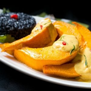 Roasted kabocha squash with curried sauce and black forbidden rice.