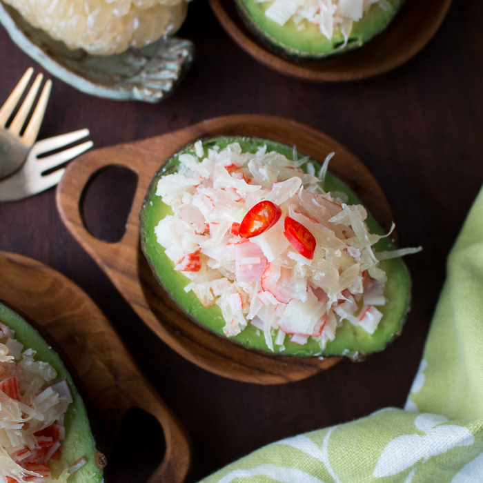 Thai Pomelo Crab Salad Avocado in wooden bowls.