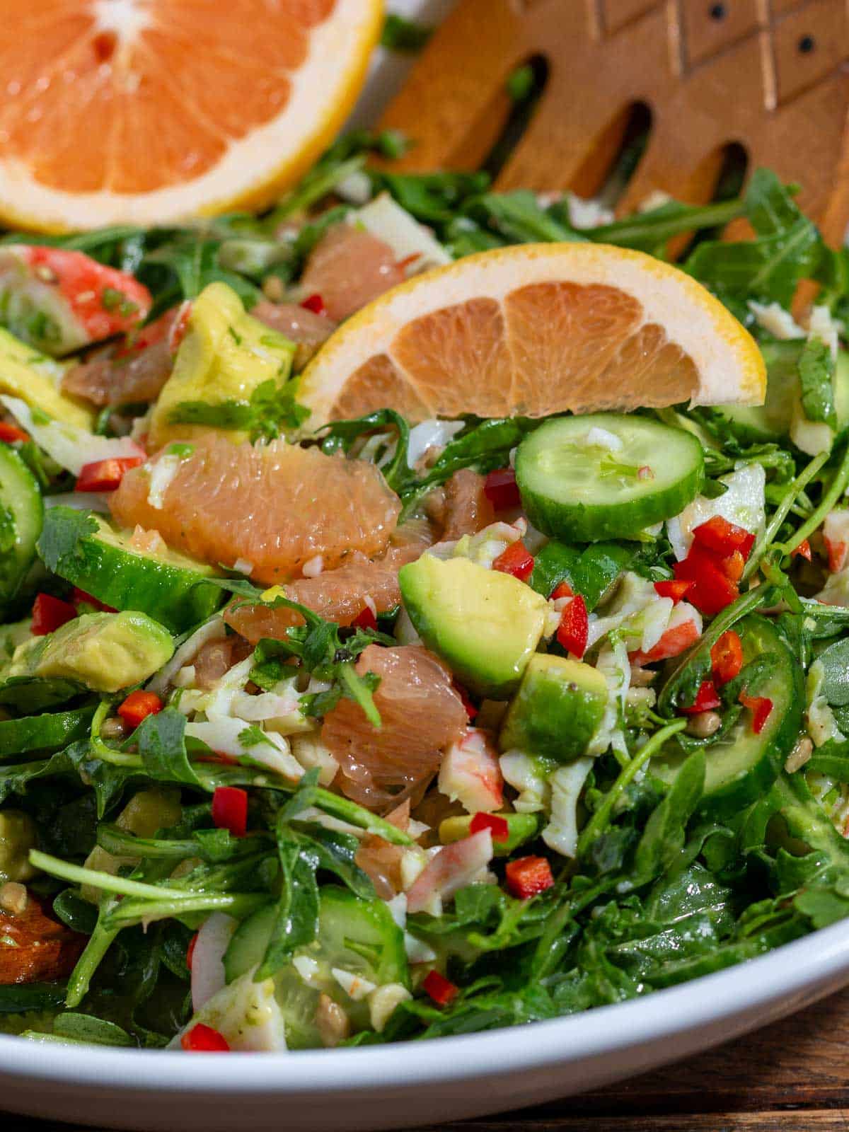 Tossed crab meat and avocado salad garnished with grapefruit segments.