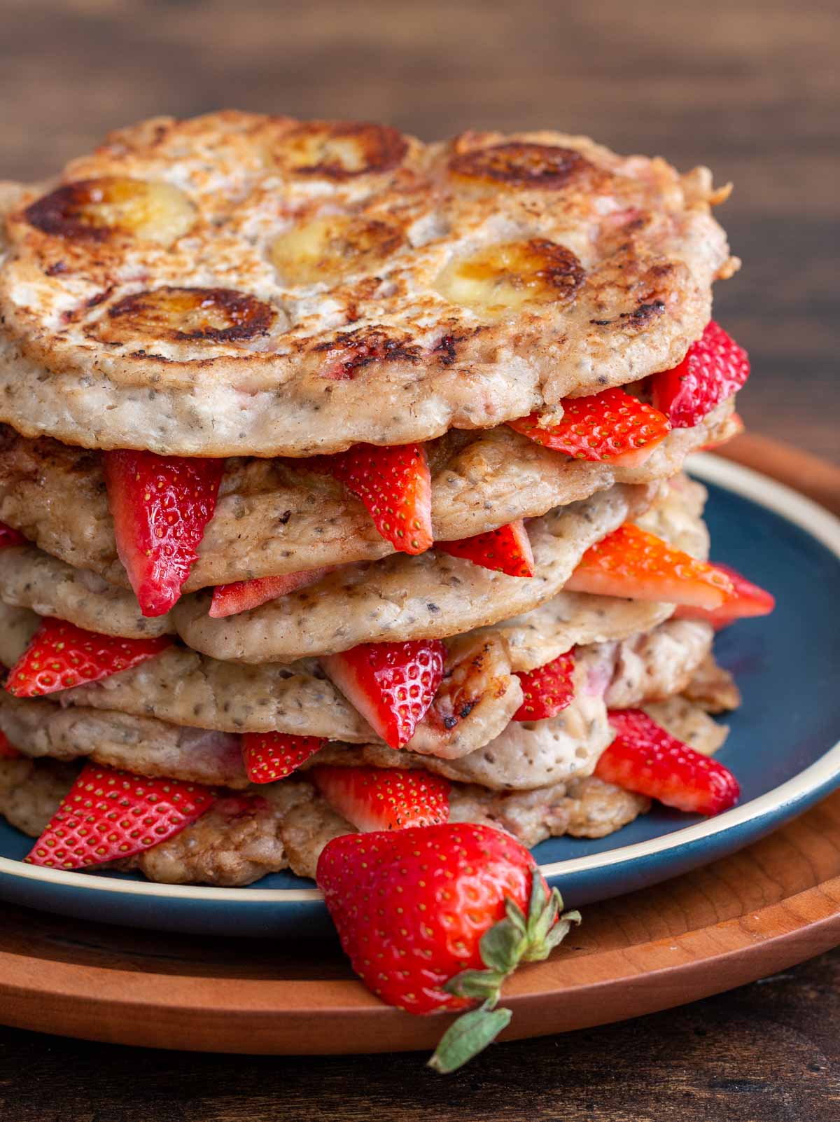 Stack of pancakes showing the caramelized banana slices.