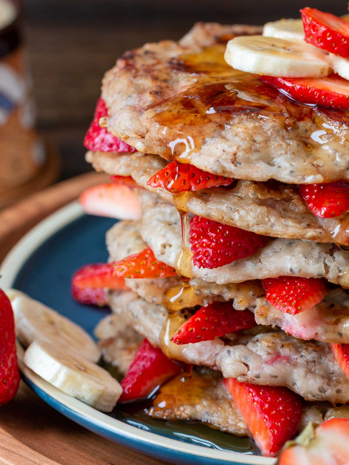 Syrup dripping down the side of the pancake.