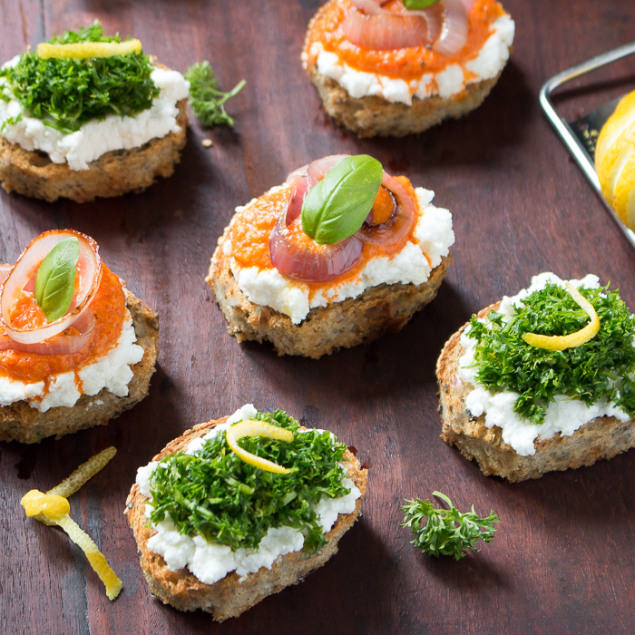 Healthy Ricotta Crostini made 2 ways with red pepper pesto and gremolata. 