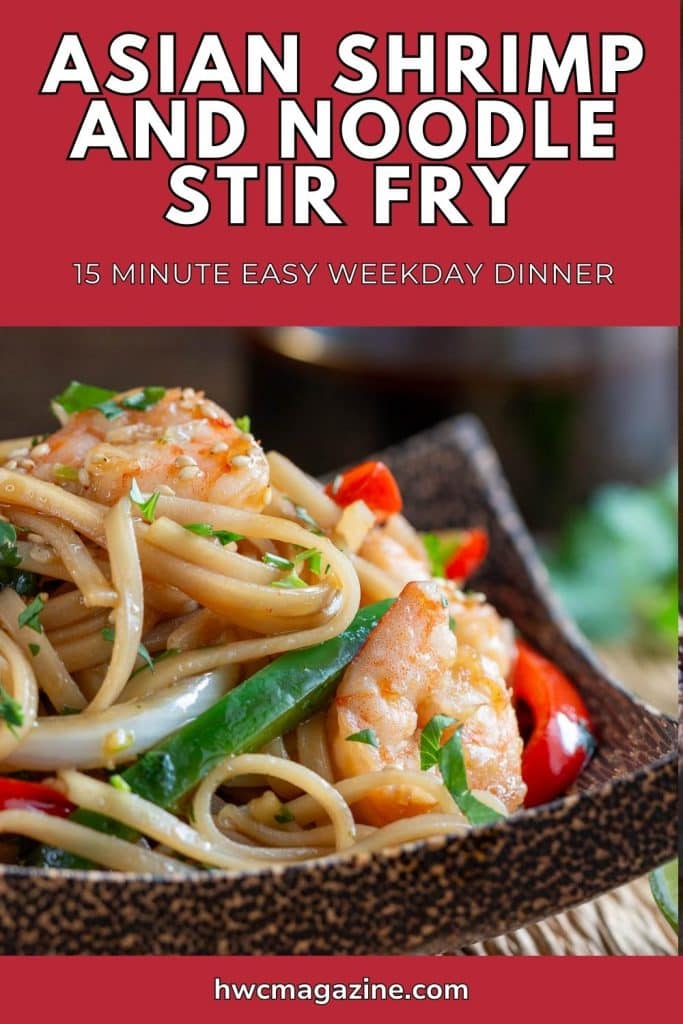 Saucy shrimp noodles with bell peppers and cilantro in a wooden bowl.