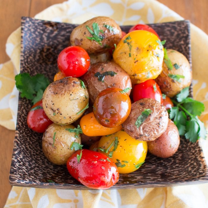 Herbs de Provence Baby Potatoes and Tomatoes with fresh green herbs.