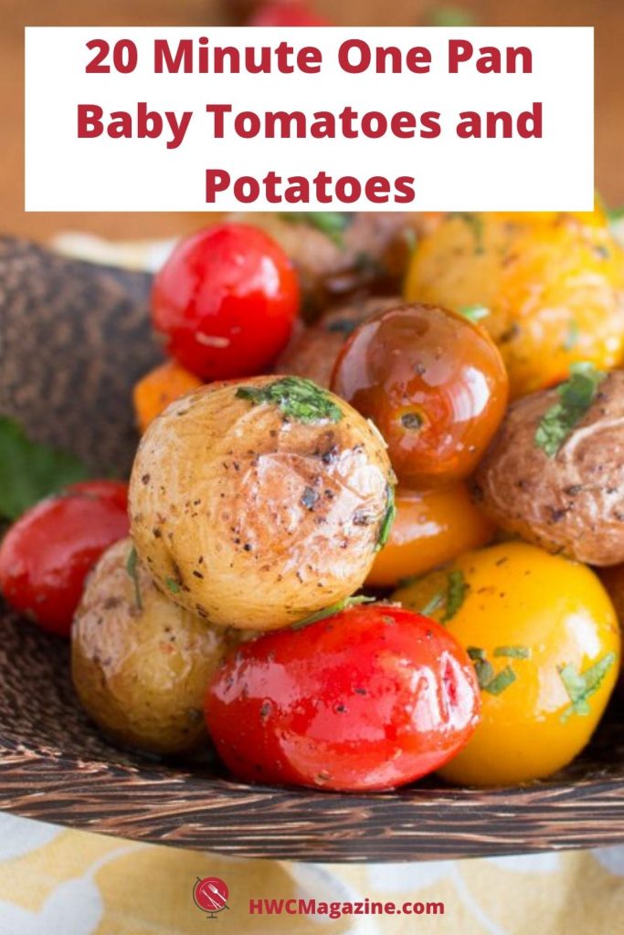 Baby potatoes and tomatoes in a wooden bowl.
