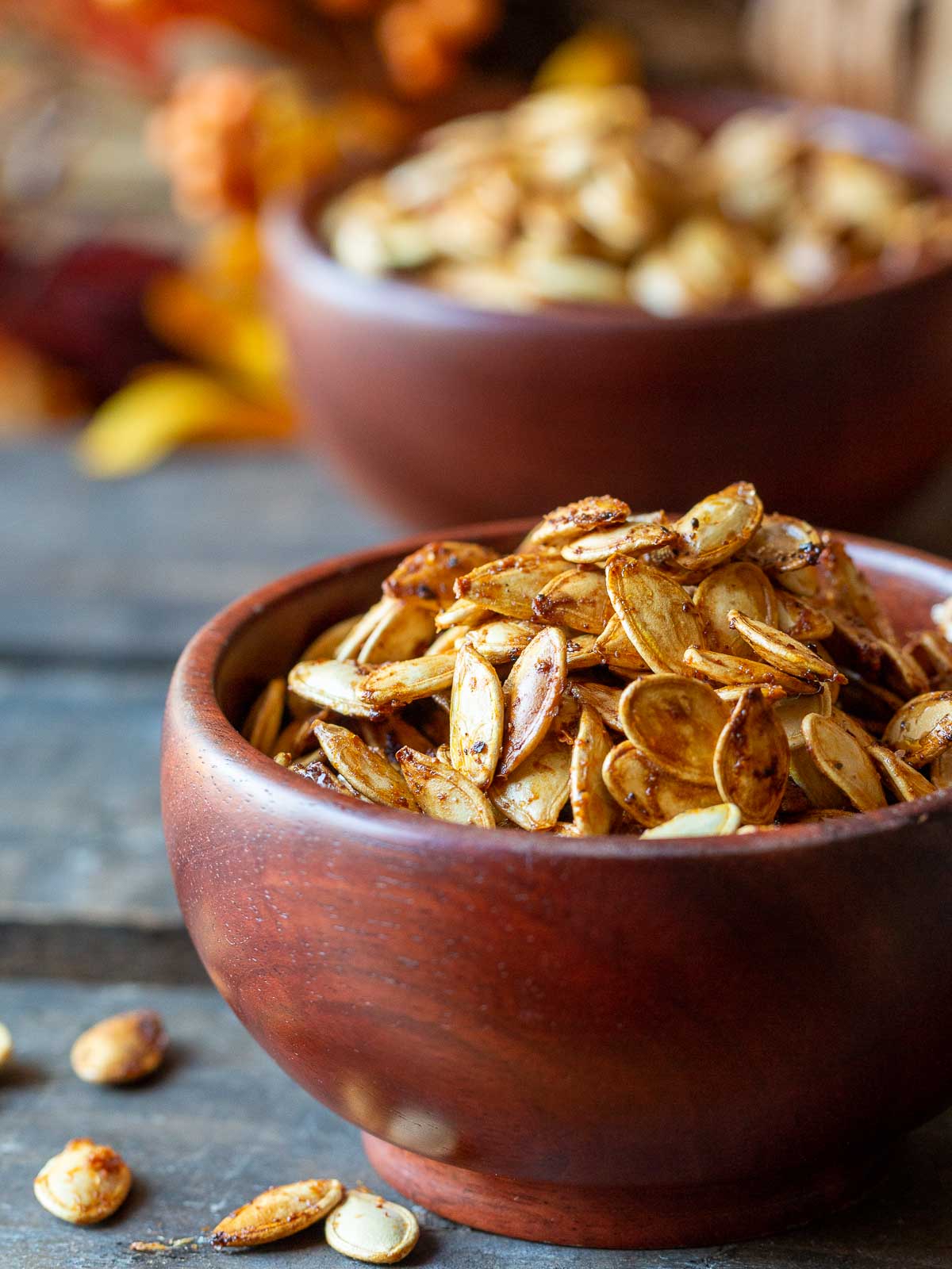 Extra crispy pumpkin seeds in wooden bowls.