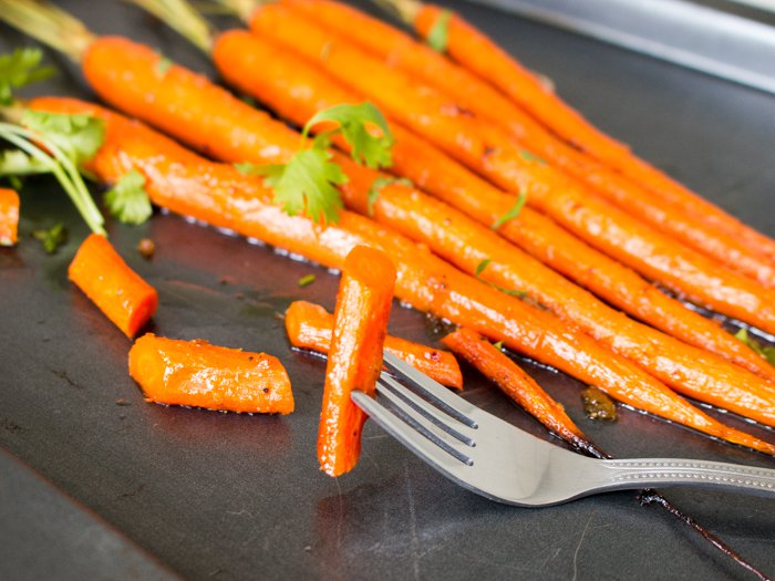 The Bite shot of a delicious tender carrot. 