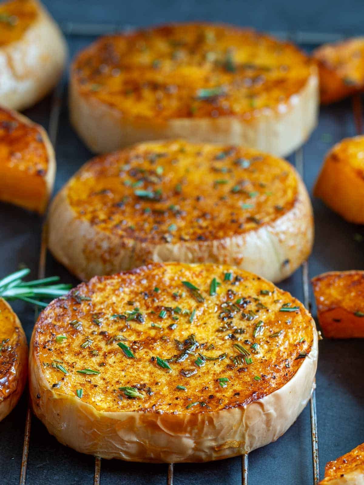 Hot out of the oven roasted butternut squash on a wire tray.