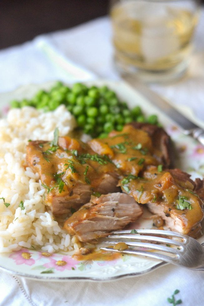 Slow Cooked Peach Barbecue Smothered Pork Chops / https://www.hwcmagazine.com