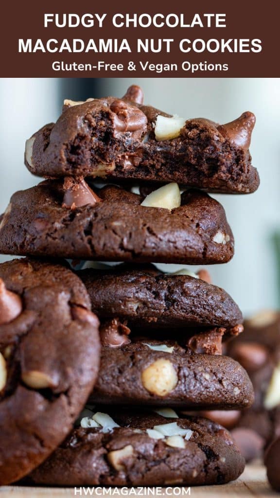 Dark chocolate macadamia nut cookies with a bite out of one.
