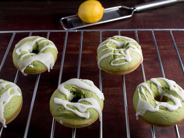 Decorated matcha donuts ready to add a little lemon zest on top.