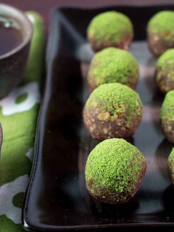 Matcha balls with tea and green tea towel. 