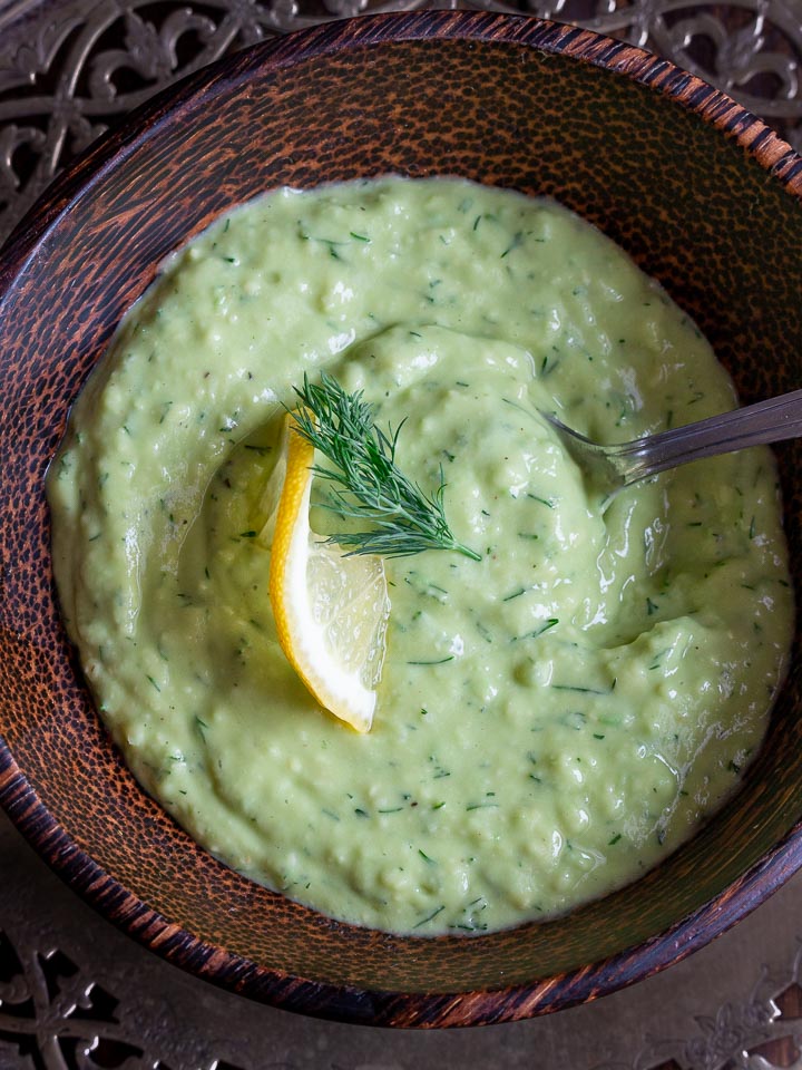 Creamy Avocado Sauce in a wooden bowl.