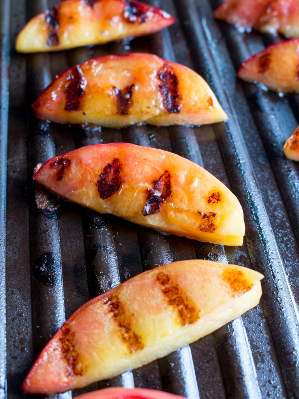 Nectarine on the grill with grill marks.