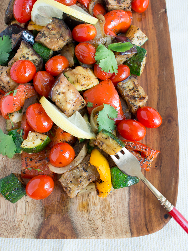 Grilled French vegetables on a wooden platter.